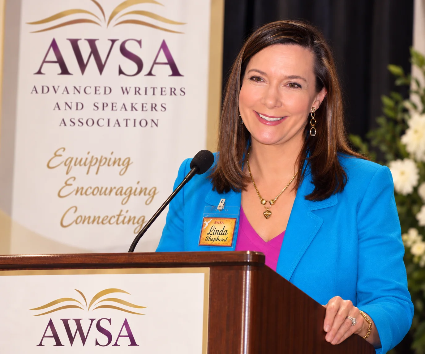Linda Evans Shepherd speaking at an AWSA podium